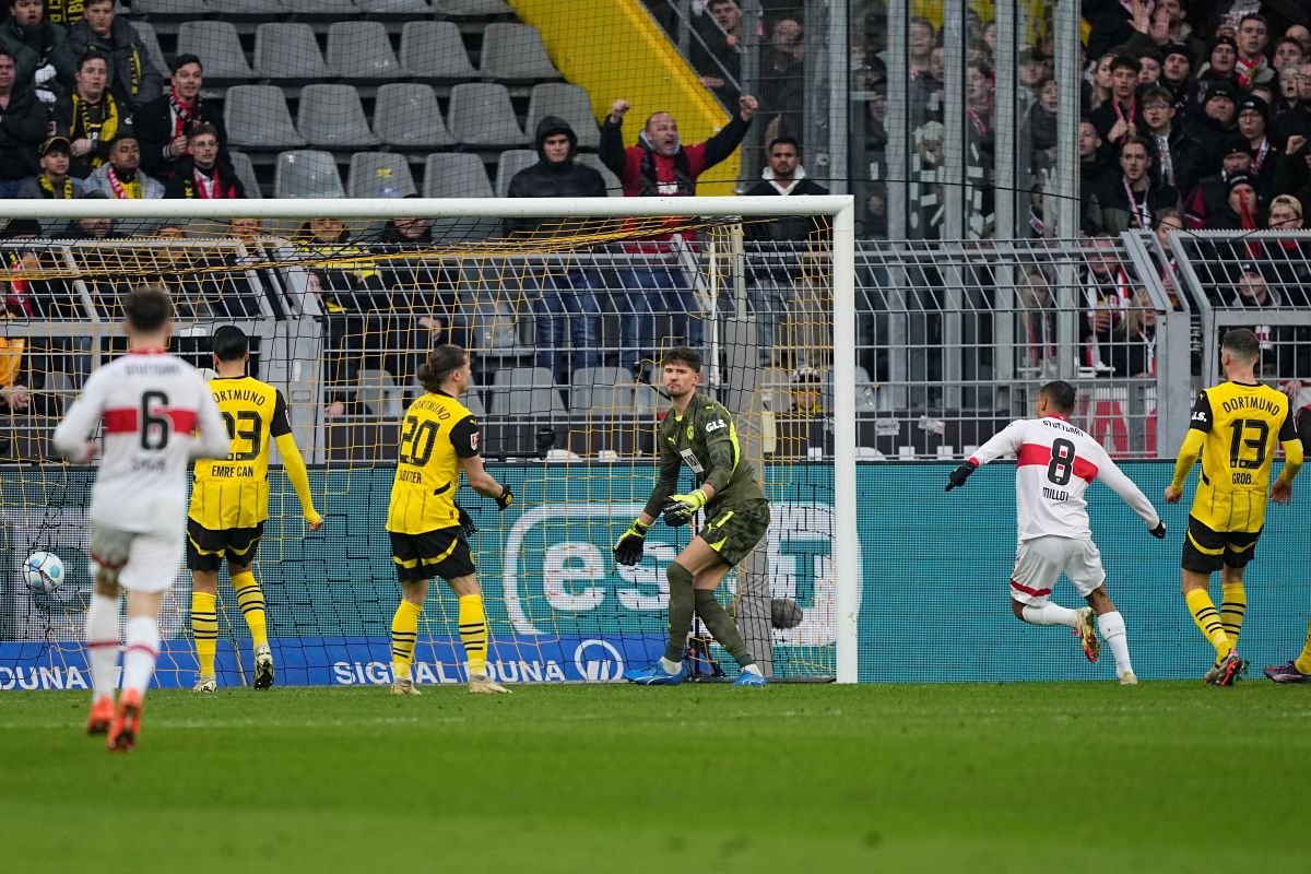 Stuttgart players celebrate after Dortmund's Waldemar Anton scored an own goal during the German Bundesliga soccer match between Borussia Dortmund and VfB Stuttgart at the Signal-Iduna Park in Dortmund, Germany, Saturday, Feb. 8, 2025. (AP Photo/Martin Meissner)