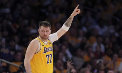 Los Angeles Lakers guard Luka Doncic gestures as he comes back in during the first half of an NBA basketball game against the Utah Jazz, Monday, Feb. 10, 2025, in Los Angeles. (AP Photo/Mark J. Terrill)