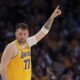 Los Angeles Lakers guard Luka Doncic gestures as he comes back in during the first half of an NBA basketball game against the Utah Jazz, Monday, Feb. 10, 2025, in Los Angeles. (AP Photo/Mark J. Terrill)