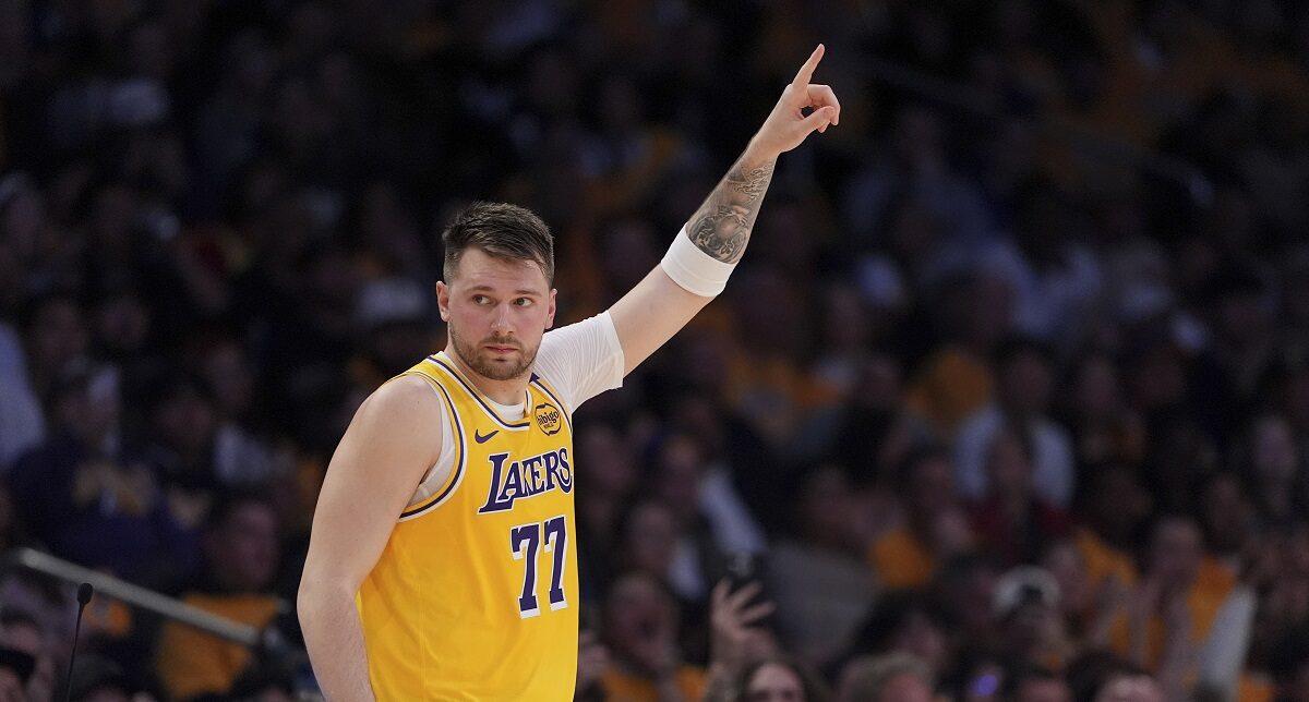 Los Angeles Lakers guard Luka Doncic gestures as he comes back in during the first half of an NBA basketball game against the Utah Jazz, Monday, Feb. 10, 2025, in Los Angeles. (AP Photo/Mark J. Terrill)