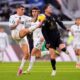 Empoli's Luca Marianucci, left, fights for the ball with Dušan Vlahović during the Serie A soccer match between Juventus and Empoli at the Juventus Stadium in Turin, Italy, Sunday, Feb. 2, 2024. (Fabio Ferrari/LaPresse via AP)