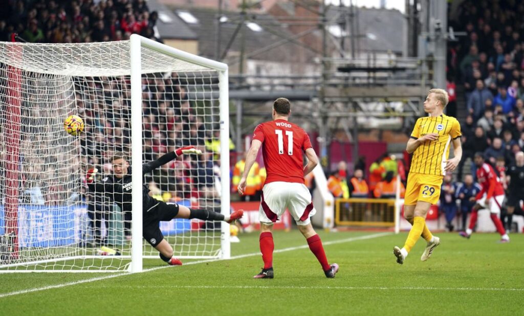 Nottingham Forest's Chris Wood scores his side's third goal of the game during the Premier League match between Brighton and Nottingham Forest at the City Ground, Nottingham, England, Saturday Feb. 1, 2025. (Martin Rickett/PA via AP)