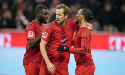 Bayern's Leroy Sane, right, is congratulated by Bayern's Harry Kane, center, after scoring his sides second goal during the German Bundesliga soccer match between Bayern Munich and Werder Bremen at the Allianz Arena in Munich, Germany, Friday, Feb. 7, 2025. (AP Photo/Matthias Schrader)