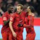 Bayern's Leroy Sane, right, is congratulated by Bayern's Harry Kane, center, after scoring his sides second goal during the German Bundesliga soccer match between Bayern Munich and Werder Bremen at the Allianz Arena in Munich, Germany, Friday, Feb. 7, 2025. (AP Photo/Matthias Schrader)