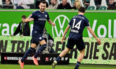 Bochum's Erhan Masovic, left, celebrates scoring during the Bundesliga soccer match between VfL Wolfsburg and VfL Bochum at Volkswagen Arena, Wolfsburg, Germany, Saturday Feb. 22, 2025. (Swen Pförtner/dpa via AP)