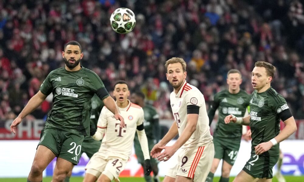 Celtic's Cameron Carter-Vickers, left, Bayern's Harry Kane, centre, Celtic's Alistair Johnston, right, in action during the Champions League playoff second leg soccer match between FC Bayern Munich and Celtic Glasgow at the Allianz Arena in Munich, Germany, Tuesday, Feb. 18, 2025. (AP Photo/Matthias Schrader)