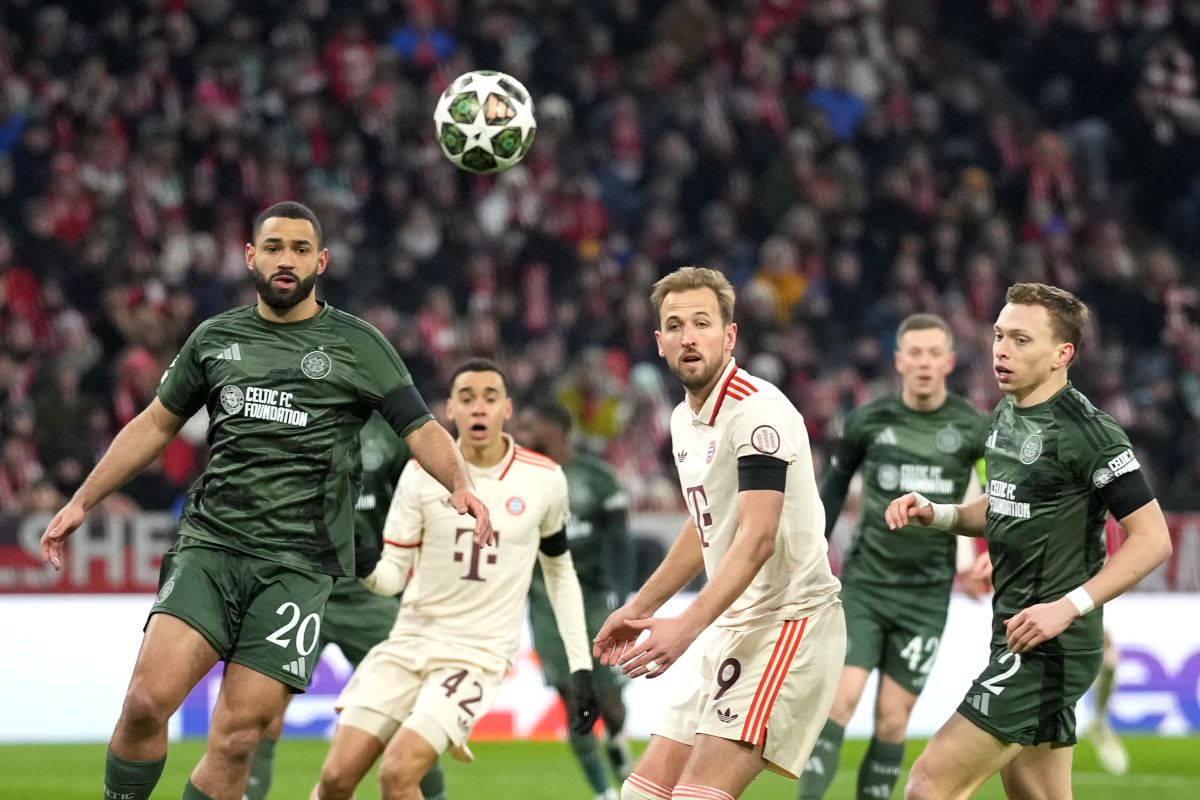 Celtic's Cameron Carter-Vickers, left, Bayern's Harry Kane, centre, Celtic's Alistair Johnston, right, in action during the Champions League playoff second leg soccer match between FC Bayern Munich and Celtic Glasgow at the Allianz Arena in Munich, Germany, Tuesday, Feb. 18, 2025. (AP Photo/Matthias Schrader)