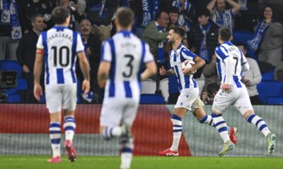 Real Sociedad's Brais Mendez, second right, celebrates with teammates after scoring the opening goal during the Europa League playoff second leg soccer match between Real Sociedad and Midtjylland at the Anoeta stadium, in San Sebastian, Spain, Thursday, Feb. 20, 2025. (AP Photo/Miguel Oses)