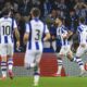 Real Sociedad's Brais Mendez, second right, celebrates with teammates after scoring the opening goal during the Europa League playoff second leg soccer match between Real Sociedad and Midtjylland at the Anoeta stadium, in San Sebastian, Spain, Thursday, Feb. 20, 2025. (AP Photo/Miguel Oses)