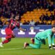 Fulham's Ryan Sessegnon scores their side's first goal of the game during the English Premier League soccer match between Wolverhampton Wanderers and Fulham at Molineux Stadium, Wolverhampton, England, Tuesday, Feb. 25, 2025. (Jacob King/PA via AP)