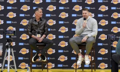 Los Angeles Lakers' Luka Doncic speaks next to general manager Rob Pelinka during an introductory NBA basketball press conference Tuesday, Feb. 4, 2025, in El Segundo, Calif. (AP Photo/Jae C. Hong)