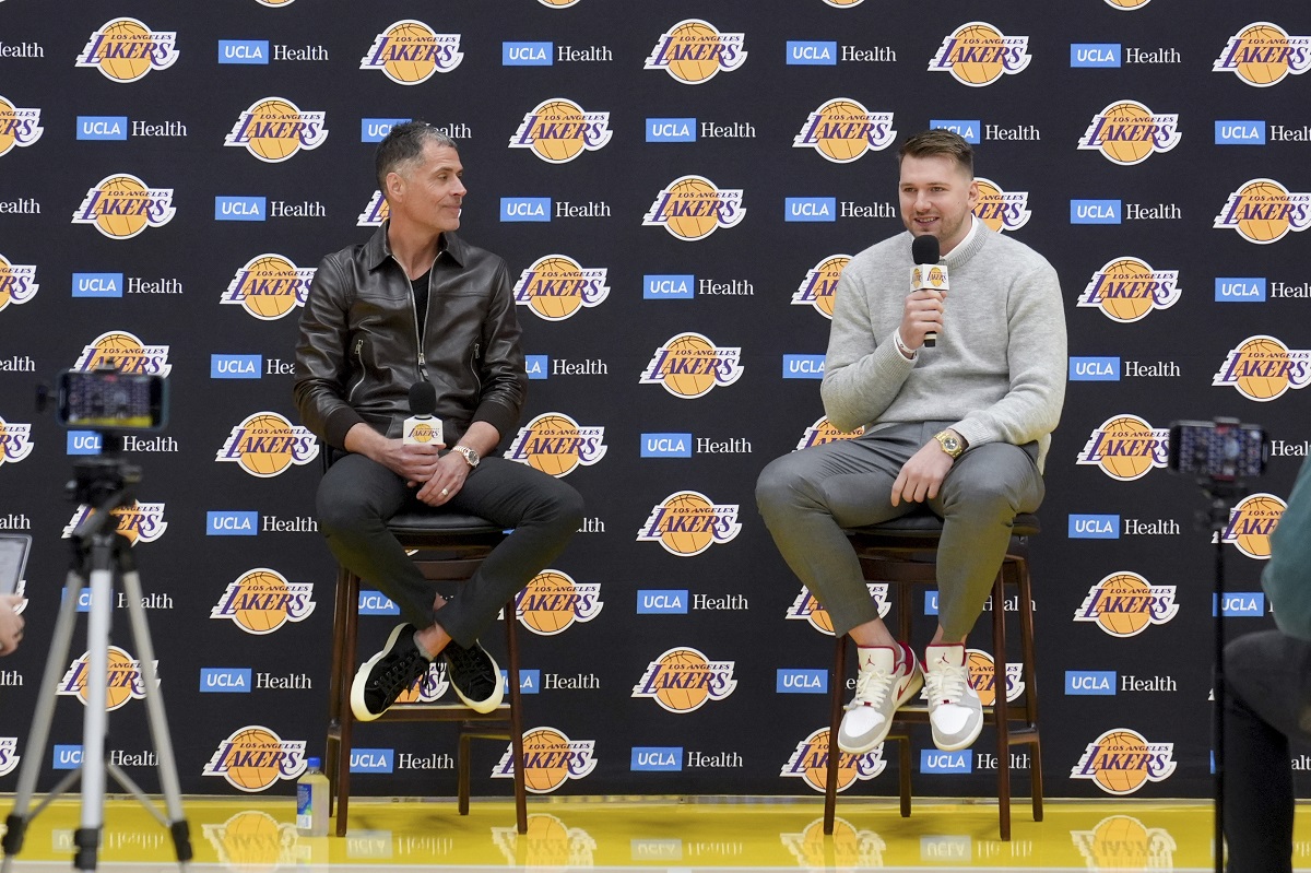 Los Angeles Lakers' Luka Doncic speaks next to general manager Rob Pelinka during an introductory NBA basketball press conference Tuesday, Feb. 4, 2025, in El Segundo, Calif. (AP Photo/Jae C. Hong)