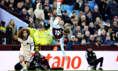 Aston Villa's Matty Cash hits the floor during their English Premier League soccer match against Chelsea at Villa Park, Birmingham, England, Saturday, Feb. 22, 2025. (Nick Potts/PA via AP)