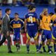 Coach Fernando Gago of Argentina's Boca Juniors, left, and his players react after losing a penalty shootout against Peru's Alianza Lima during a Copa Libertadores soccer match at La Bombonera stadium in Buenos Aires, Argentina, Tuesday, Feb. 25, 2025. (AP Photo/Gustavo Garello)