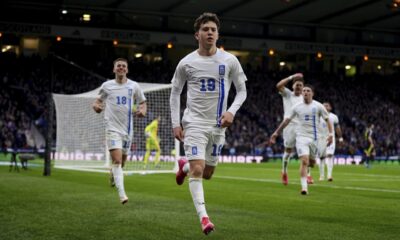 Greece's Konstantinos Karetsas celebrates scoring their side's second goal of the game during the UEFA Nations League play-offs, second leg soccer match between Scotland and Greece at Hampden Park, Glasgow, Scotland, Sunday March 23, 2025. (Andrew Milligan/PA via AP)