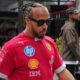 Ferrari driver Lewis Hamilton of Britain walks through the paddock ahead of the Australian Formula One Grand Prix at Albert Park, in Melbourne, Australia, Thursday, March 13, 2025. (AP Photo/Heath McKinley )