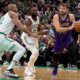 Los Angeles Lakers guard Luka Doncic, right, manoeuvres around Boston Celtics center Al Horford, left, and Boston Celtics guard Jaylen Brown, right, during the first half of an NBA basketball game, Saturday, March 8, 2025, in Boston. (AP Photo/Mark Stockwell)