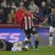 Aston Villa's Morgan Rogers falls following a challenge from Brentford's Vitaly Janelt during the English Premier League soccer match between Brentford and Aston Villa at the Gtech Community stadium in London, Saturday, March 8, 2025. (AP Photo/Kin Cheung)