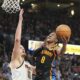 Oklahoma City Thunder forward Jalen Williams (8) shoots over Denver Nuggets center Nikola Jokic (15) during the second half of an NBA basketball game, Sunday, March 9, 2025, in Oklahoma City. (AP Photo/Kyle Phillips)