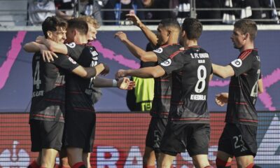 Union Berlin's Leopold Querfeld, 3rd left, celebrates scoring with teammates during the German Bundesliga soccer match between Eintracht Frankfurt and 1. FC Union Berlin at Deutsche Bank Park, in Frankfurt, Germany, Sunday, March 9, 2025. (Arne Dedert/dpa via AP)