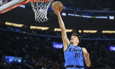 Los Angeles Clippers guard Bogdan Bogdanovic shoots during the first half of an NBA basketball game against the Charlotte Hornets, Sunday, March 16, 2025, in Inglewood, Calif. (AP Photo/William Liang)