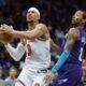 New York Knicks guard Josh Hart (3) drives to the basket against Charlotte Hornets guard Nick Smith Jr., right, during the second half of an NBA basketball game in Charlotte, N.C., Thursday, March 20, 2025. (AP Photo/Nell Redmond)