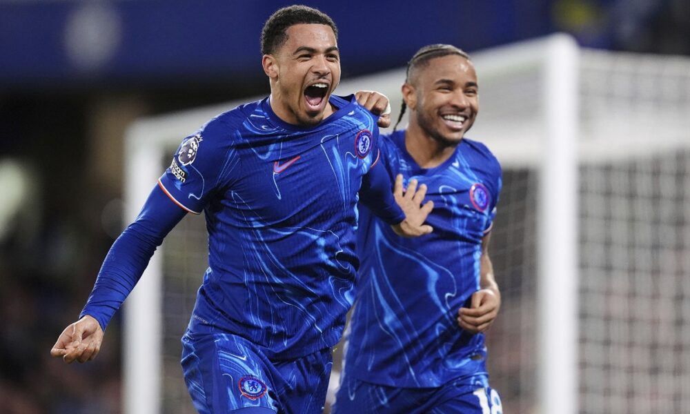 Chelsea's Levi Colwill, left, celebrates scoring their side's third goal of the game with teammate Christopher Nkunku during the English Premier League soccer match between Chelsea and Southampton at Stamford Bridge, London, Tuesday, Feb. 25, 2025. (John Walton/PA via AP)