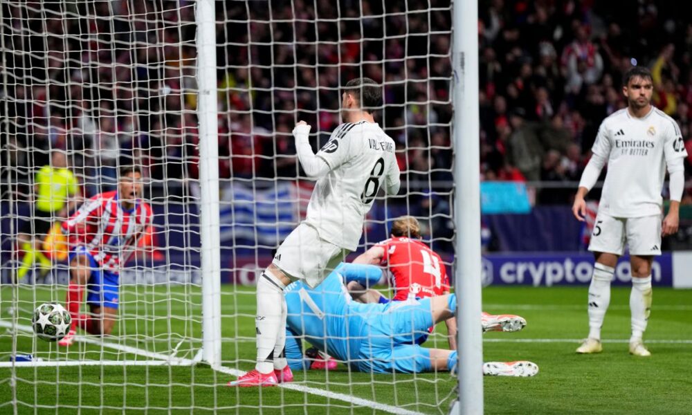 Players react after Atletico Madrid's Conor Gallagher, on the ground, scored the opening goal during the Champions League round of 16, second leg, soccer match between Atletico Madrid and Real Madrid at the Metropolitano stadium in Madrid, Spain, Wednesday, March 12, 2025. (AP Photo/Manu Fernandez)