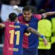 Barcelona's Raphinha, left, celebrates with his teammate Lamine Yamal after scoring his side's opening goal during the Champions League round of 16 second leg soccer match between FC Barcelona and SL Benfica at the Lluis Companys Olympic Stadium in Barcelona, Spain, Tuesday, March 11, 2025. (AP Photo/Emilio Morenatti)