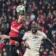 Leverkusen's Patrik Schick, left, jumps for the ball with Bayern's Dayot Upamecano during the Champions League round of 16 second leg soccer match between Bayer Leverkusen and Bayern Munich at the BayArena in Leverkusen, Germany, Tuesday, March 11, 2025. (AP Photo/Martin Meissner)