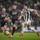 Empoli's Luca Marianucci, left, and Juventus' Dusan Vlahovic battle for the ball during an Italian Cup quarterfinal soccer match between Juventus and Empoli at the Allianz Stadium in Turin, Italy, Wednesday, Feb. 26, 2025 (Marco Alpozzi/LaPresse via AP)