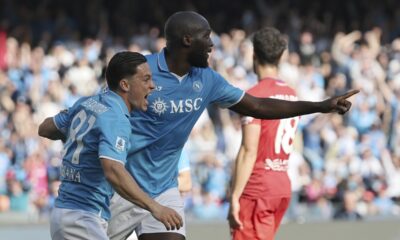 Napoli's Romelu Lukaku, right, celebrates scoring with Giacomo Raspadori during the Serie A soccer match between Napoli and Fiorentina at the Diego Armando Maradona Stadium in Naples, Italy, Sunday March 9, 2025. (Alessandro Garofalo/LaPresse via AP)