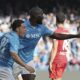 Napoli's Romelu Lukaku, right, celebrates scoring with Giacomo Raspadori during the Serie A soccer match between Napoli and Fiorentina at the Diego Armando Maradona Stadium in Naples, Italy, Sunday March 9, 2025. (Alessandro Garofalo/LaPresse via AP)