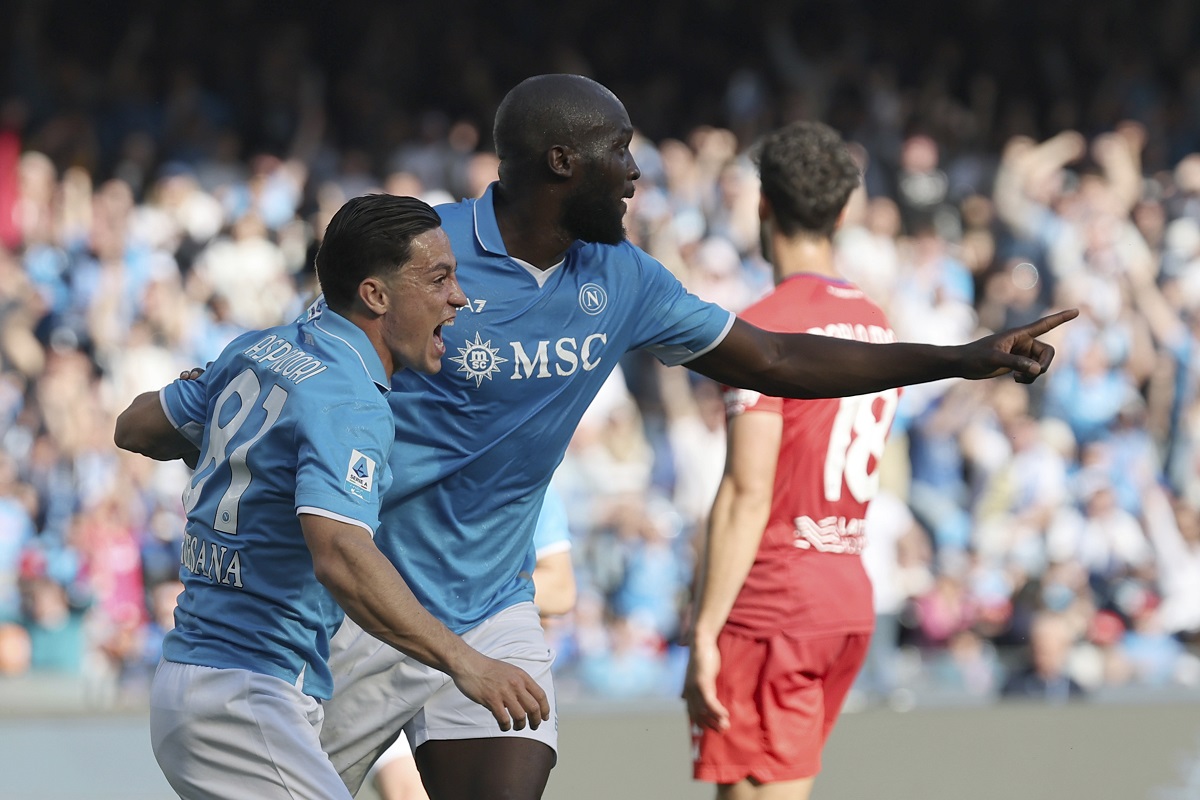 Napoli's Romelu Lukaku, right, celebrates scoring with Giacomo Raspadori during the Serie A soccer match between Napoli and Fiorentina at the Diego Armando Maradona Stadium in Naples, Italy, Sunday March 9, 2025. (Alessandro Garofalo/LaPresse via AP)