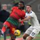 Lazio's Adam Marusic, right, challenges AC Milan's Rafael Leao during the Serie A soccer match between AC Milan and Lazio at the San Siro stadium, in Milan, Italy, Sunday, March 2, 2025. (AP Photo/Antonio Calanni)