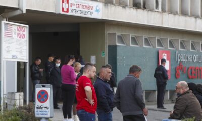 CORRECTS CITY TO SKOPJE - People wait in front of the hospital in Skopje, North Macedonia, Sunday, March 16, 2025, after a massive fire in a nightclub in the town of Kocani. (AP Photo/Boris Grdanoski)