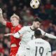 Denmark's Mika Biereth, left, and Portugals Bruno Fernandes vie for the ball during the Nations League playoff soccer match between Denmark and Portugal at Parken in Copenhagen, Thursday, March 20, 2024. (Liselotte Sabroe/Ritzau Scanpix via AP)