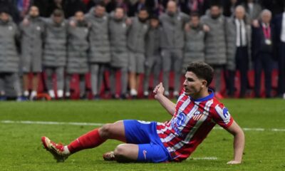 Atletico Madrid's Julian Alvarez, reacts after falling to the ground taking a penalty kick during a shootout at the end of the Champions League round of 16, second leg, soccer match between Atletico Madrid and Real Madrid at the Metropolitano stadium in Madrid, Spain, Wednesday, March 12, 2025. (AP Photo/Manu Fernandez)