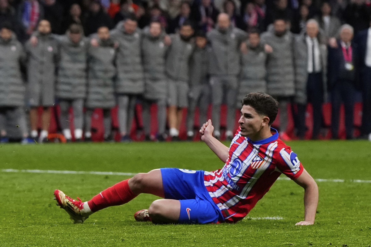 Atletico Madrid's Julian Alvarez, reacts after falling to the ground taking a penalty kick during a shootout at the end of the Champions League round of 16, second leg, soccer match between Atletico Madrid and Real Madrid at the Metropolitano stadium in Madrid, Spain, Wednesday, March 12, 2025. (AP Photo/Manu Fernandez)