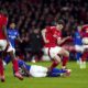 Ipswich Town's Ben Johnson, center, slides in on Nottingham Forest's Ryan Yates during the English FA Cup fifth soccer round match between Nottingham Forest and Ipswich Town at the City Ground, Nottingham, England, Monday, March 3, 2025. (Mike Egerton/PA via AP)