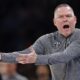 Denver Nuggets coach Michael Malone questions an official after a call during the first half of an NBA basketball game against the Oklahoma City Thunder, Monday, March 10, 2025, in Oklahoma City. (AP Photo/Nate Billings)