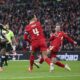 Newcastle's Alexander Isak, left, scores his side's second goal during the EFL Cup final soccer match between Liverpool and Newcastle at Wembley Stadium in London, Sunday, March 16, 2025. (AP Photo/Scott Heppell)