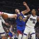 Denver Nuggets center Nikola Jokic, center, fights for control of a rebound between Sacramento Kings center Jonas Valanciunas, left, and forward DeMar DeRozan in the second half of an NBA basketball game Wednesday, March 5, 2025, in Denver. (AP Photo/David Zalubowski)