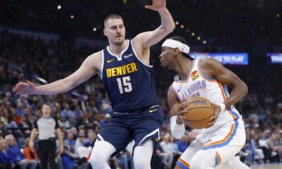 Oklahoma City Thunder guard Shai Gilgeous-Alexander, right, drives against Denver Nuggets center Nikola Jokic (15) during the first half of an NBA basketball game Monday, March 10, 2025, in Oklahoma City. (AP Photo/Nate Billings)