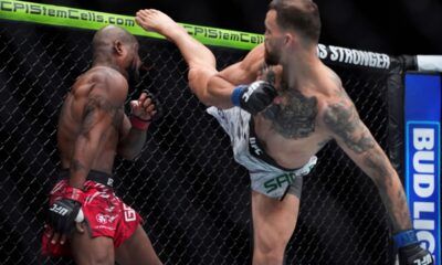 Mauricio Ruffy kicks King Green during a UFC 313 mixed martial arts lightweight bout Saturday, March 8, 2025, in Las Vegas. (AP Photo/John Locher)