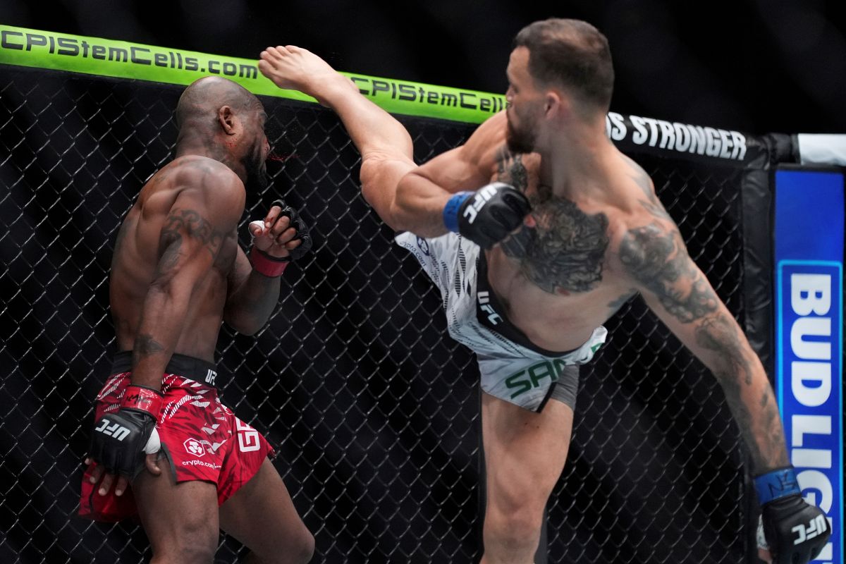 Mauricio Ruffy kicks King Green during a UFC 313 mixed martial arts lightweight bout Saturday, March 8, 2025, in Las Vegas. (AP Photo/John Locher)