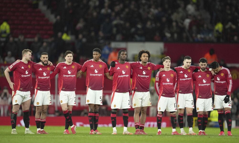 Manchester United players react after losing a penalty shootout during the English FA Cup soccer match against Fulham at the Old Trafford stadium in Manchester, England, Sunday, March 2, 2025. (AP Photo/Jon Super)