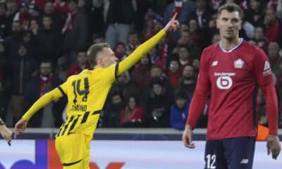 Dortmund's Maximilian Beier celebrates after scoring during the Champions League round of 16 second leg soccer match between Lille and Borussia Dortmund in Villeneuve-d'Ascq , Wednesday, March 12, 2025. (AP Photo/Michel Euler)