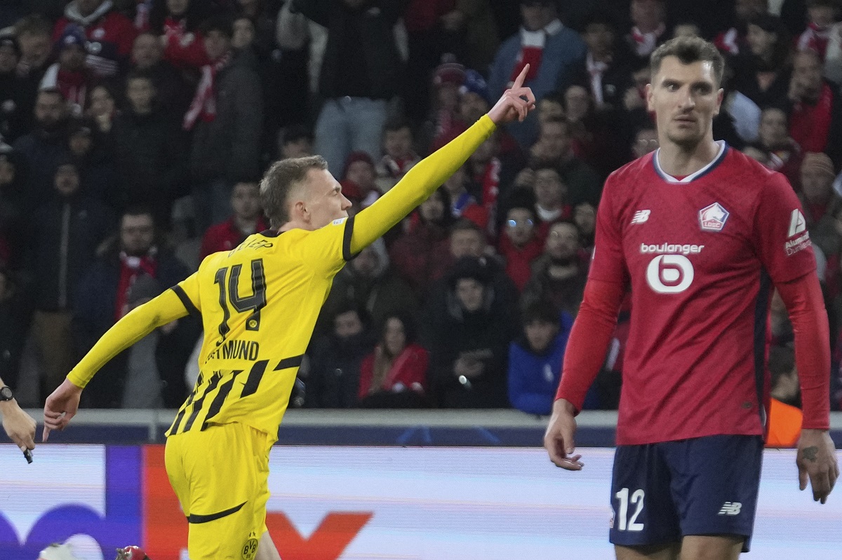 Dortmund's Maximilian Beier celebrates after scoring during the Champions League round of 16 second leg soccer match between Lille and Borussia Dortmund in Villeneuve-d'Ascq , Wednesday, March 12, 2025. (AP Photo/Michel Euler)