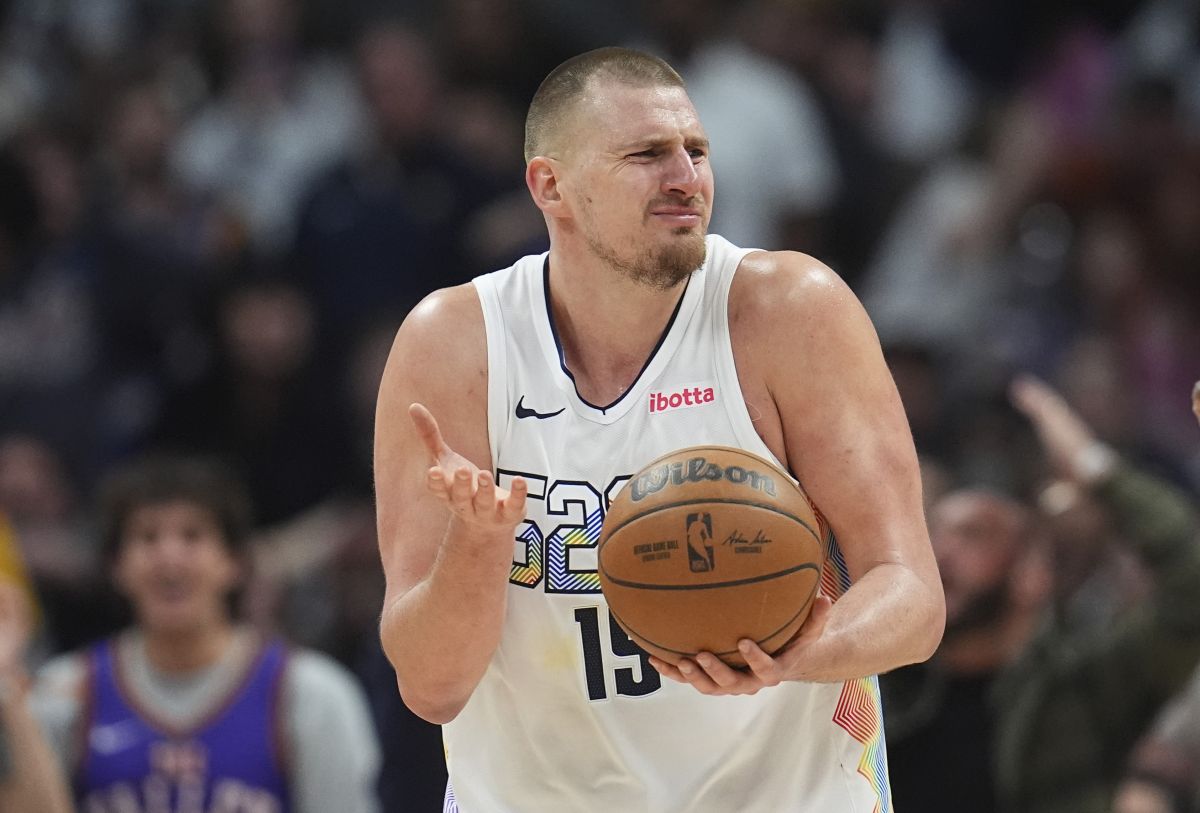 Denver Nuggets center Nikola Jokic reacts after being called for a foul in the second half of an NBA basketball game against the Phoenix Suns Friday, March 7, 2025, in Denver. (AP Photo/David Zalubowski)